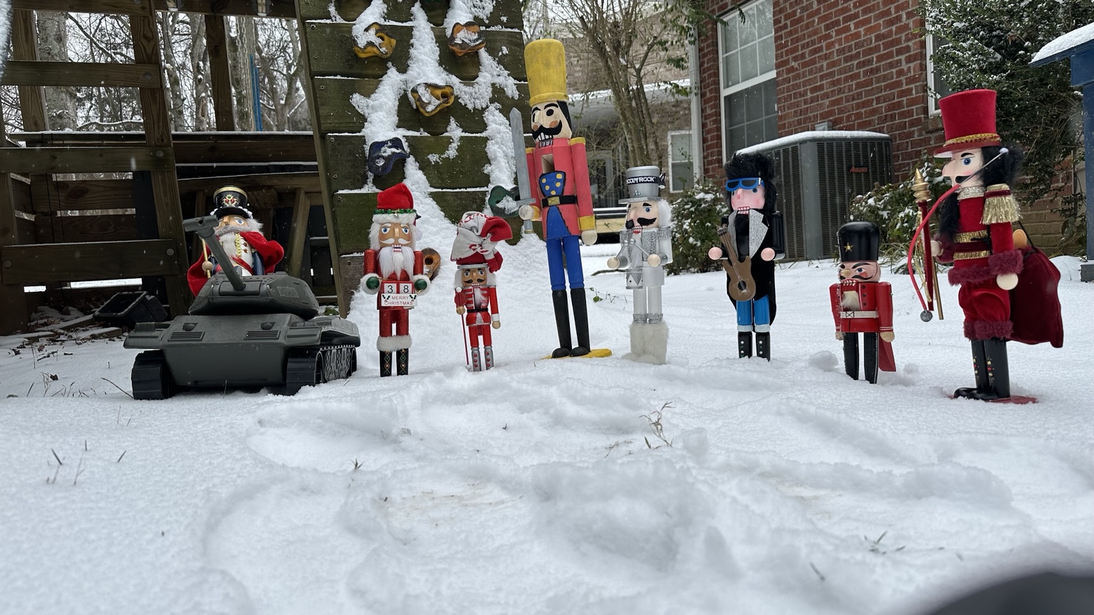 Spycrackers assembled in snow with armored vehicle